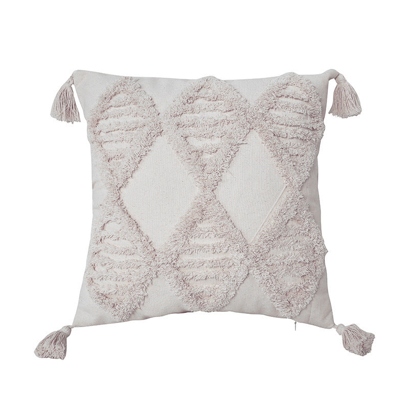 Boho tufted pillow cushion cover on a neutral-toned sofa with textured detailing