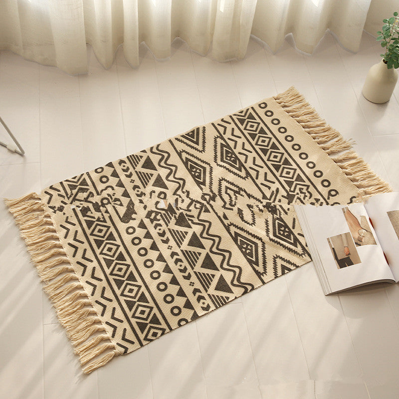 Woven tassel carpet placed in a cozy living room with neutral furniture and boho accents