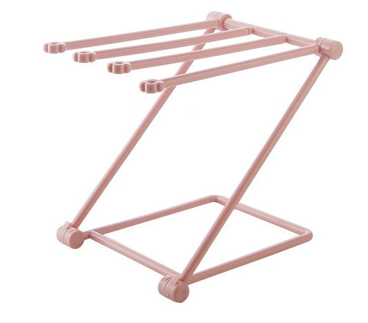 Foldable dishcloth shelf and organizer for modern kitchen spaces.