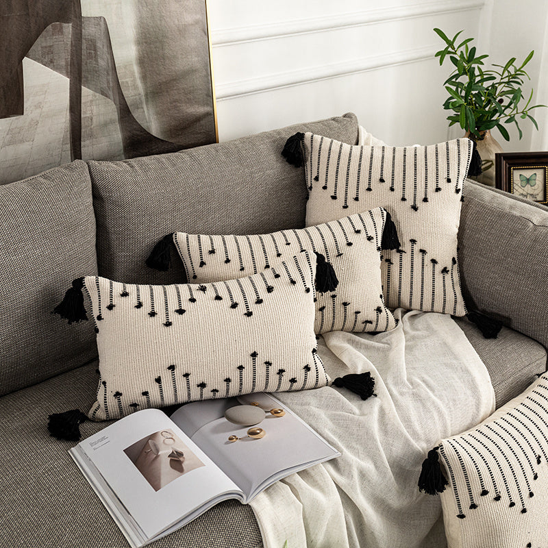 Bohemian Moroccan fringe pillowcase with ethnic patterns on a cozy sofa setting