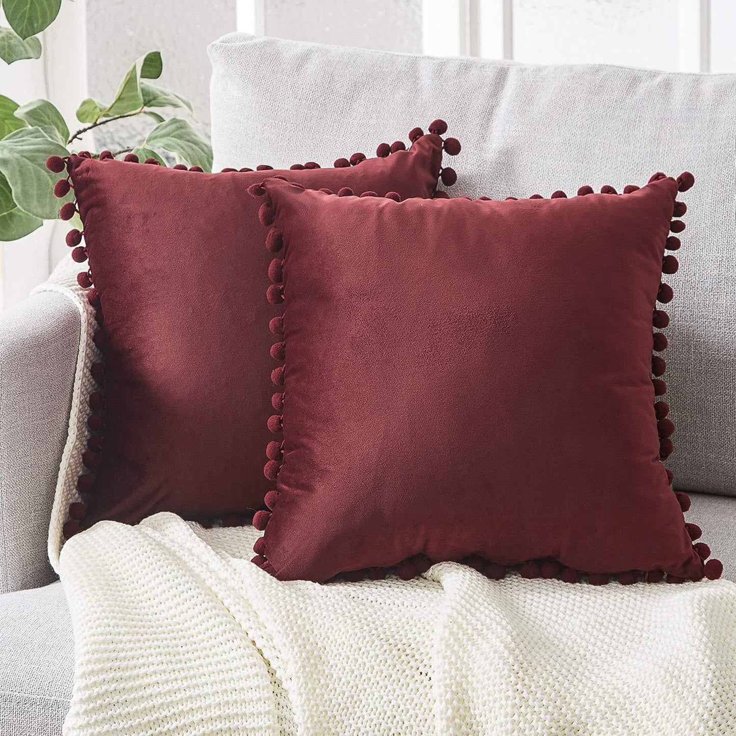 Wind velvet solid color cushion cover placed on an office chair in a stylish workspace