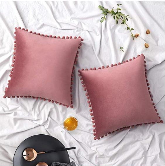 Wind velvet solid color cushion cover placed on an office chair in a stylish workspace