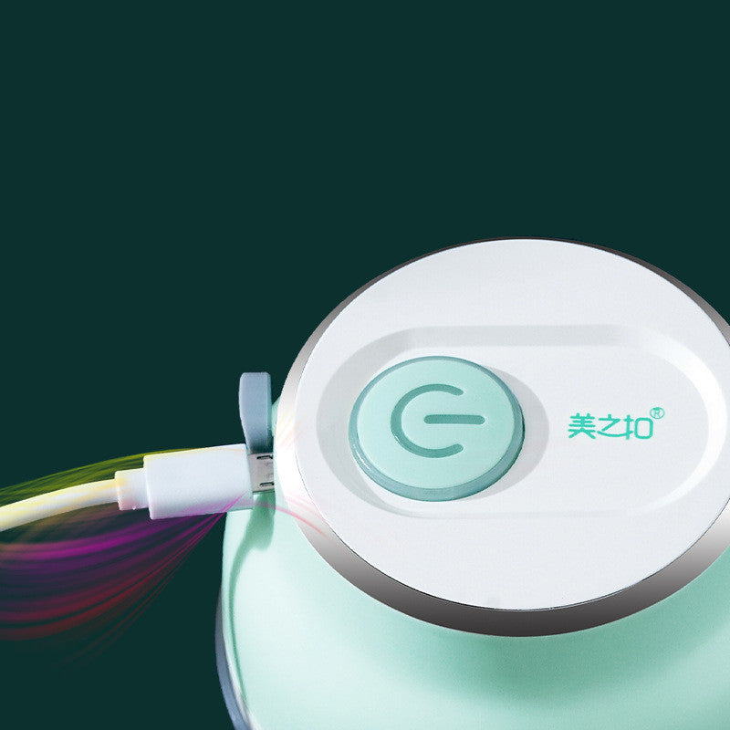 Portable electric mini garlic chopper and food grinder for quick cooking.