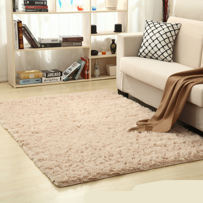 Soft carpet placed under a coffee table and beside a sofa in a cozy living room with neutral tones