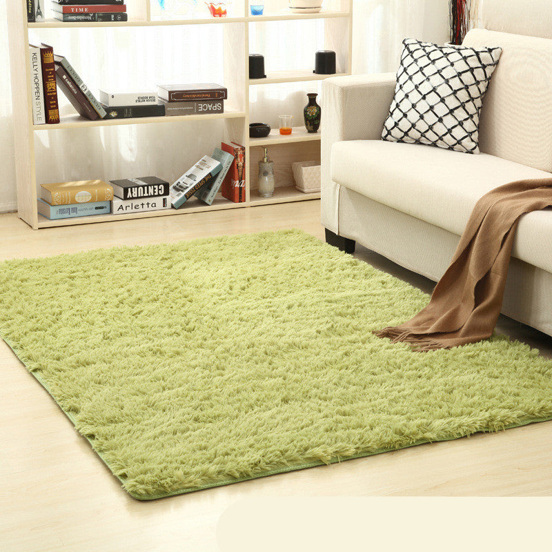 Soft carpet placed under a coffee table and beside a sofa in a cozy living room with neutral tones