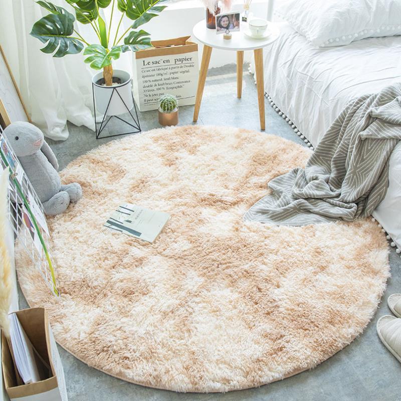Nordic round silk wool carpet placed in a minimalist living room with natural light and cozy furniture
