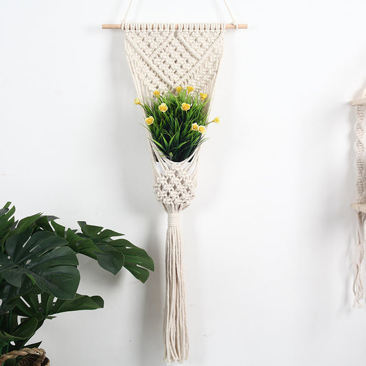 Woven net flower basket wall decoration for home and shop displays.
