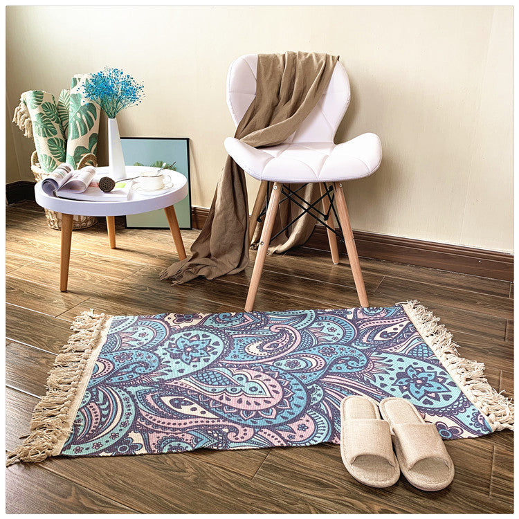 Woven tassel carpet placed in a cozy living room with neutral furniture and boho accents