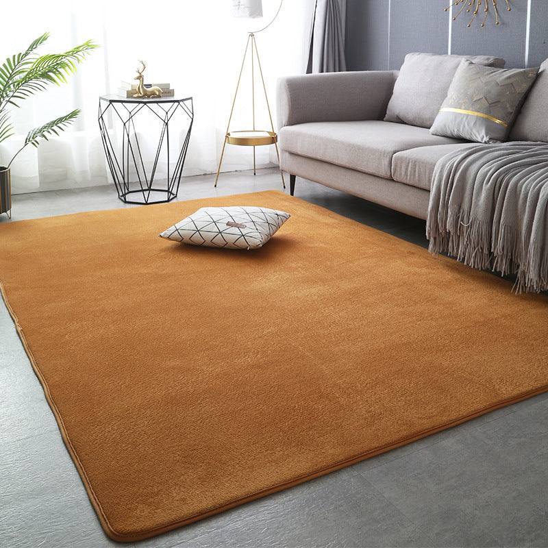 Modern minimalist coral fleece carpet in a bright living room with neutral-toned furniture and natural light