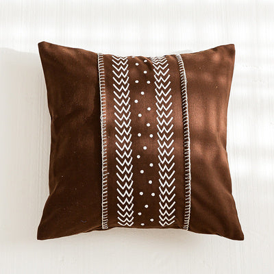 Nordic-style decorative cushion on a minimalist sofa with neutral tones