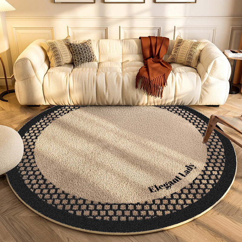 New round carpet placed in a modern living room under a coffee table with neutral décor
