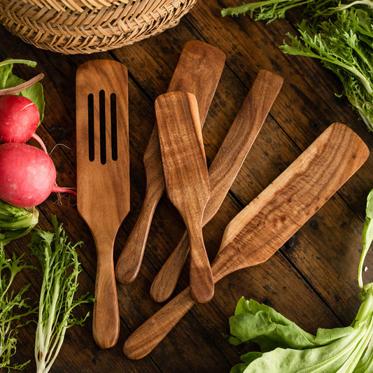 Handmade teak wood cooking spatula for salads and kitchen use.