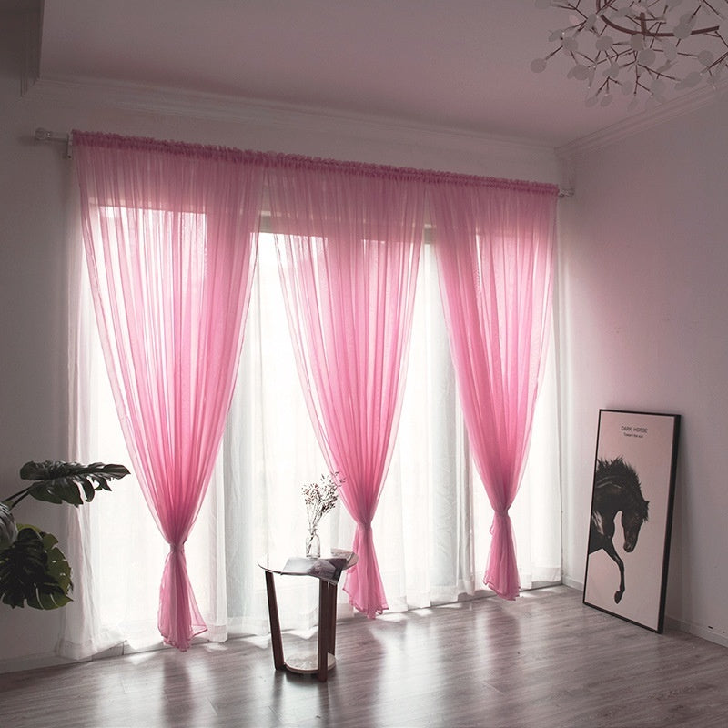 Modern solid color sheer gauze curtain on a balcony window filtering soft light