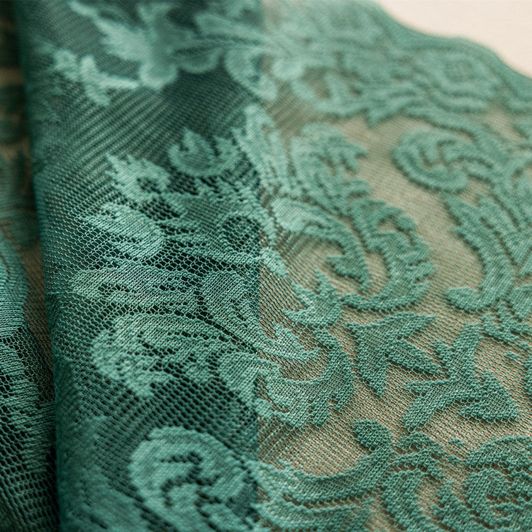 Dark green lace curtain with horse leather-inspired design for modern interiors.