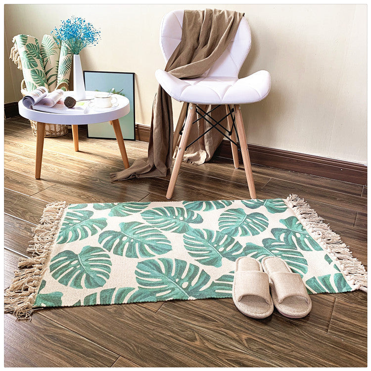 Woven tassel carpet placed in a cozy living room with neutral furniture and boho accents
