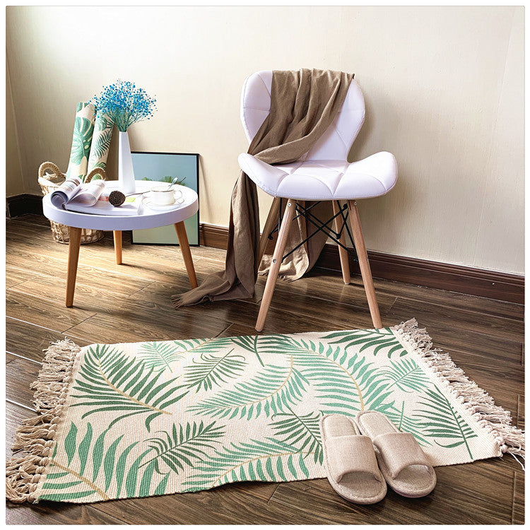 Woven tassel carpet placed in a cozy living room with neutral furniture and boho accents