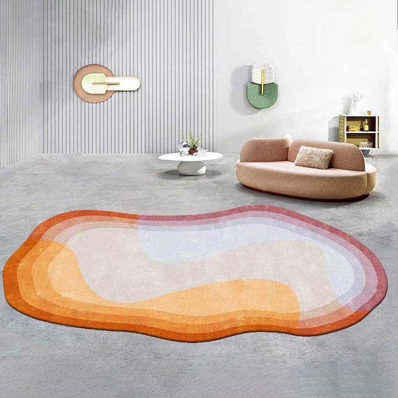 Irregular shaped carpet placed under a coffee table in a modern living room with artistic décor