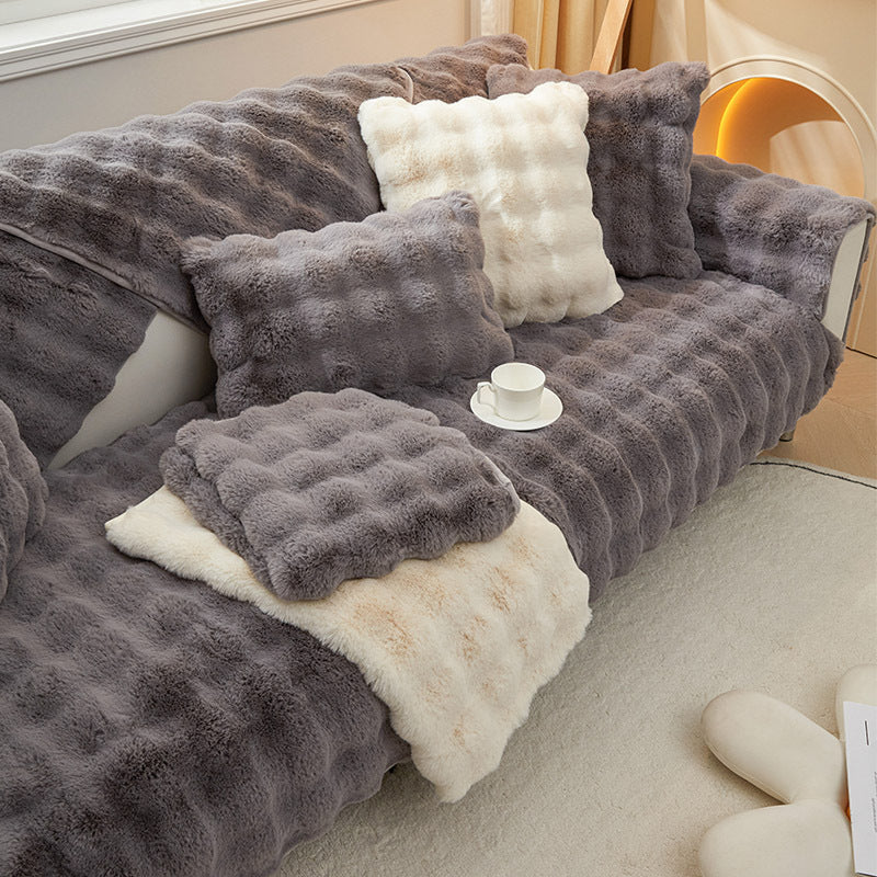 Rabbit plush sofa cushion with leather anti-skid design.
