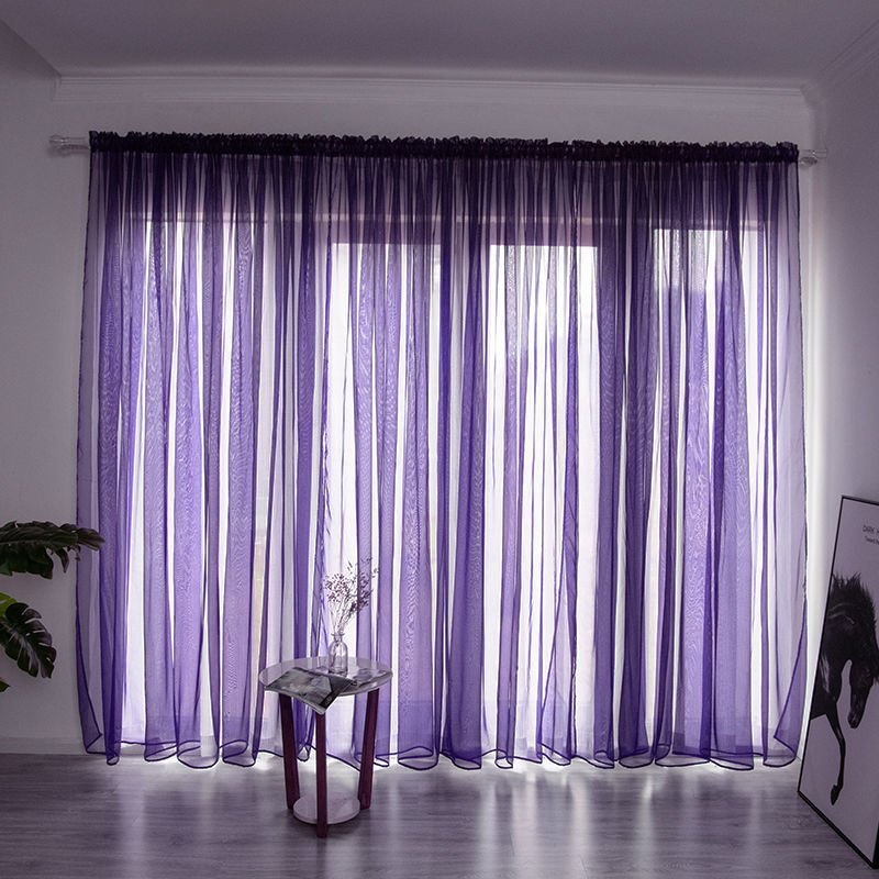 Modern solid color sheer gauze curtain on a balcony window filtering soft light