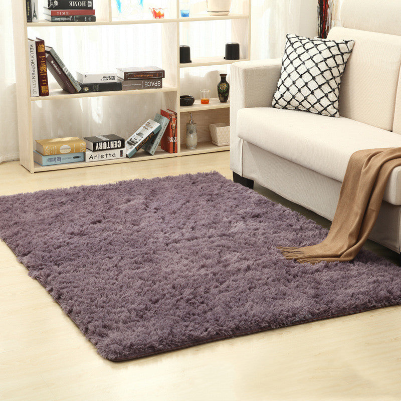 Soft carpet placed under a coffee table and beside a sofa in a cozy living room with neutral tones