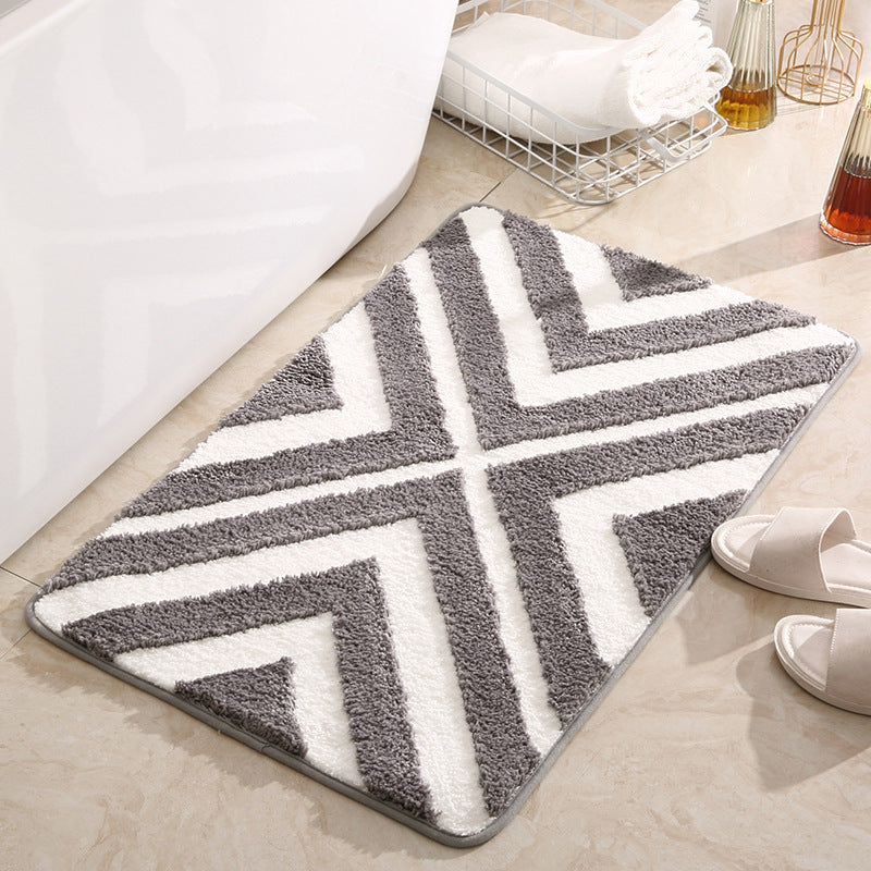 Tufted door mat placed at a living room entrance with modern décor and soft natural lighting