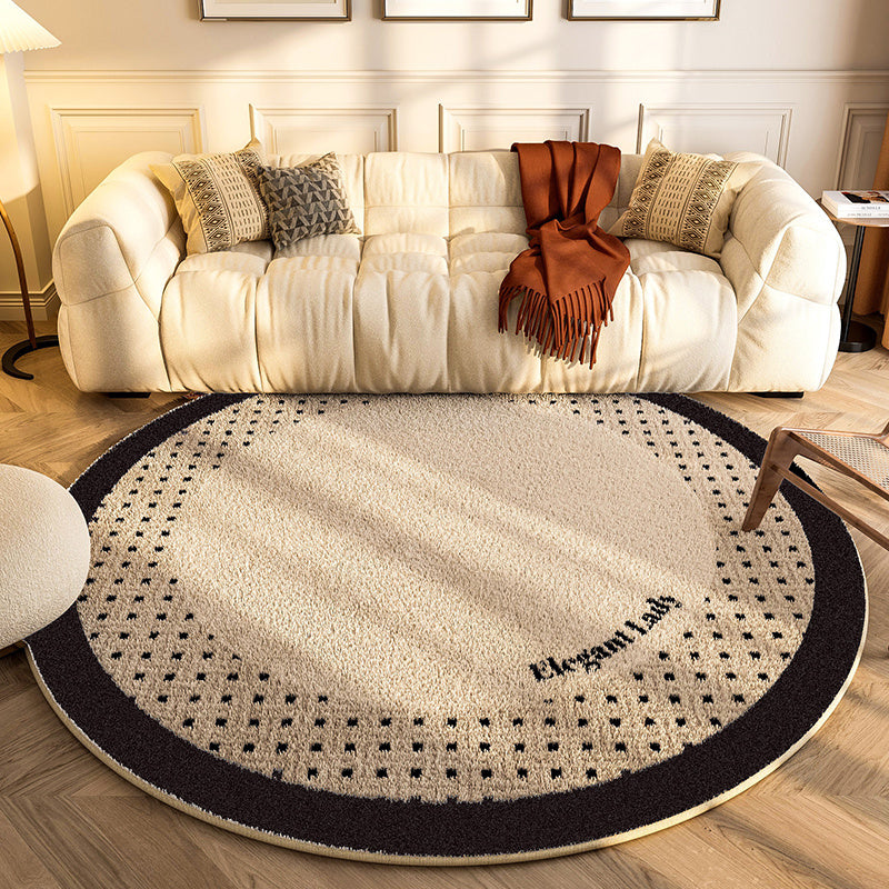 New round carpet placed in a modern living room under a coffee table with neutral décor