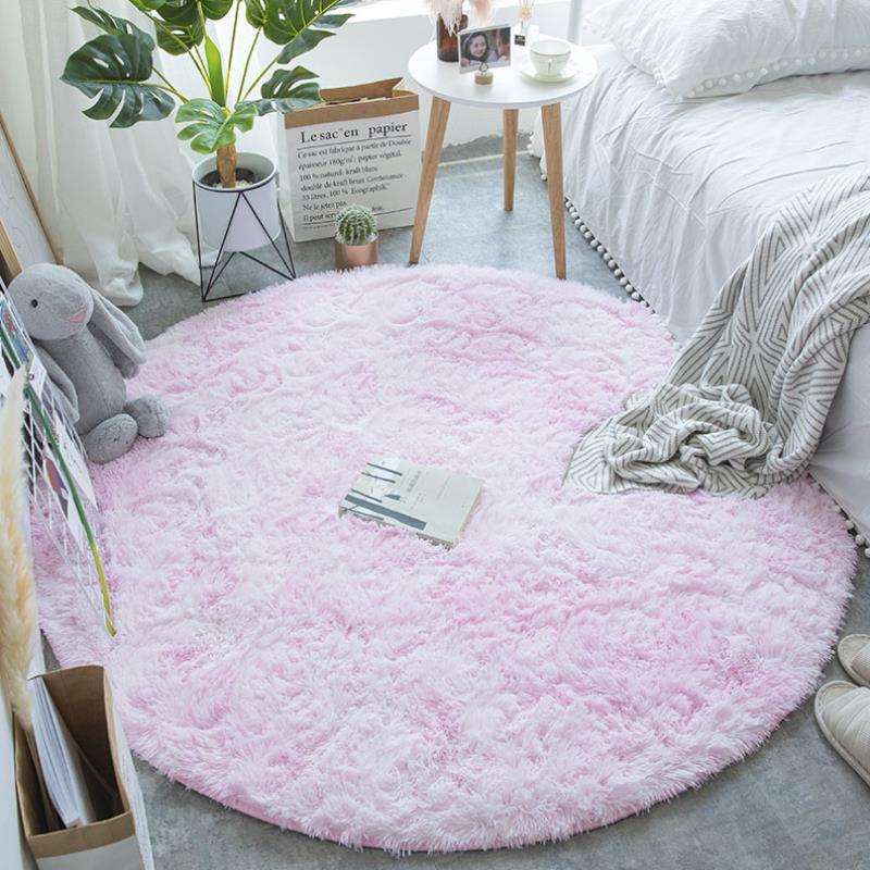 Nordic round silk wool carpet placed in a minimalist living room with natural light and cozy furniture
Nordic round silk wool carpet placed in a minimalist living room with natural light and cozy furniture