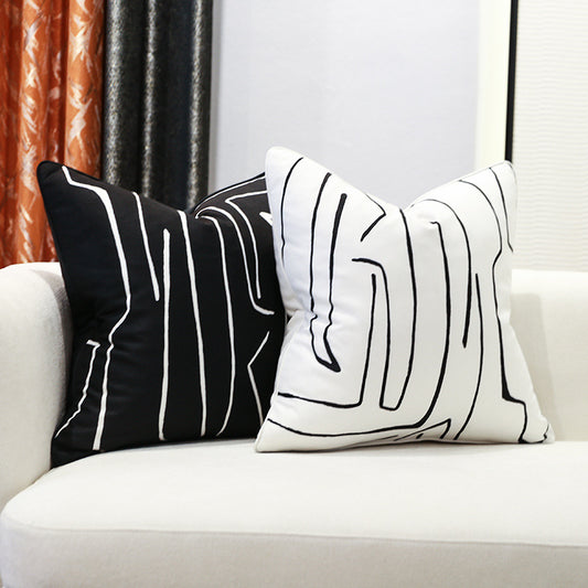 Nordic-style decorative cushion on a minimalist sofa with neutral tones

