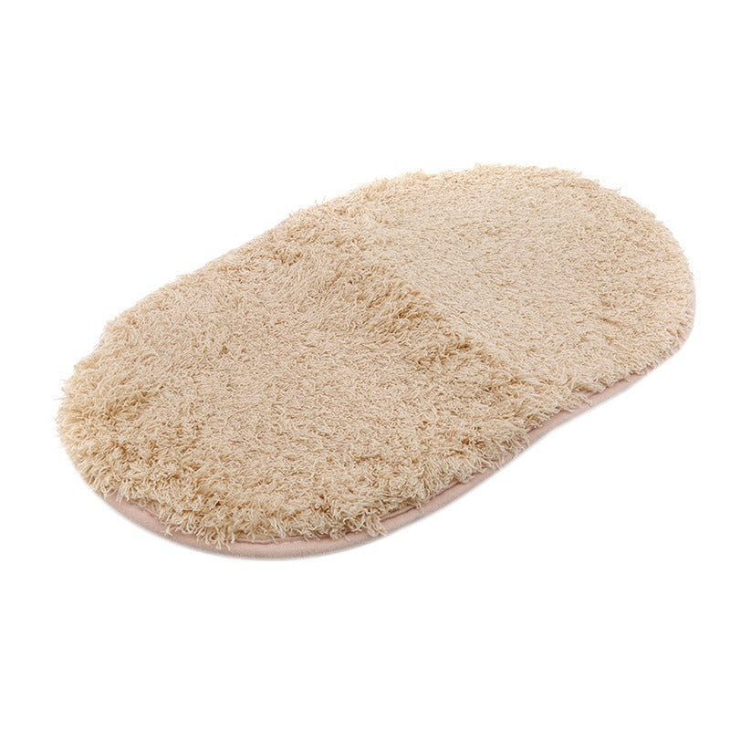 Oval-shaped absorbent carpet in a modern living room with light furniture and natural lighting

