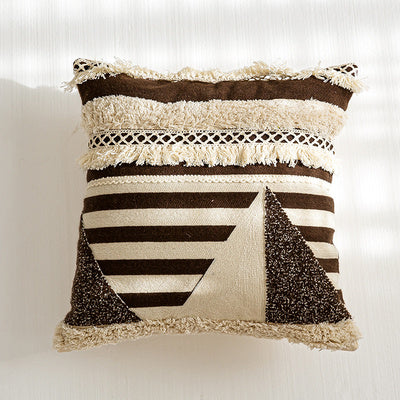 Nordic-style decorative cushion on a minimalist sofa with neutral tones

