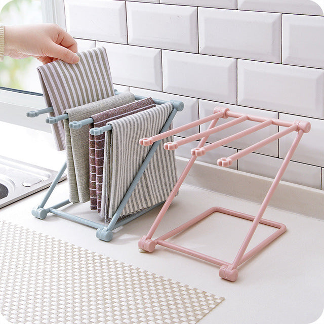 Foldable dishcloth shelf and organizer for modern kitchen spaces.