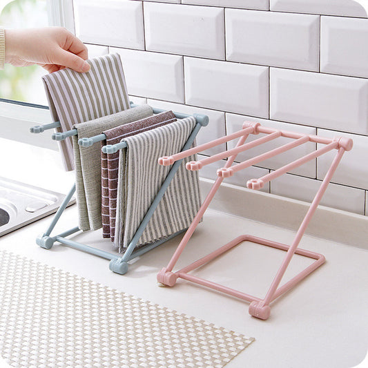 Foldable dishcloth shelf and organizer for modern kitchen spaces.