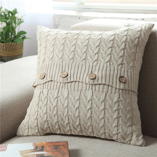 Woven Nordic minimalist pillowcase on a modern sofa in a neutral living room

