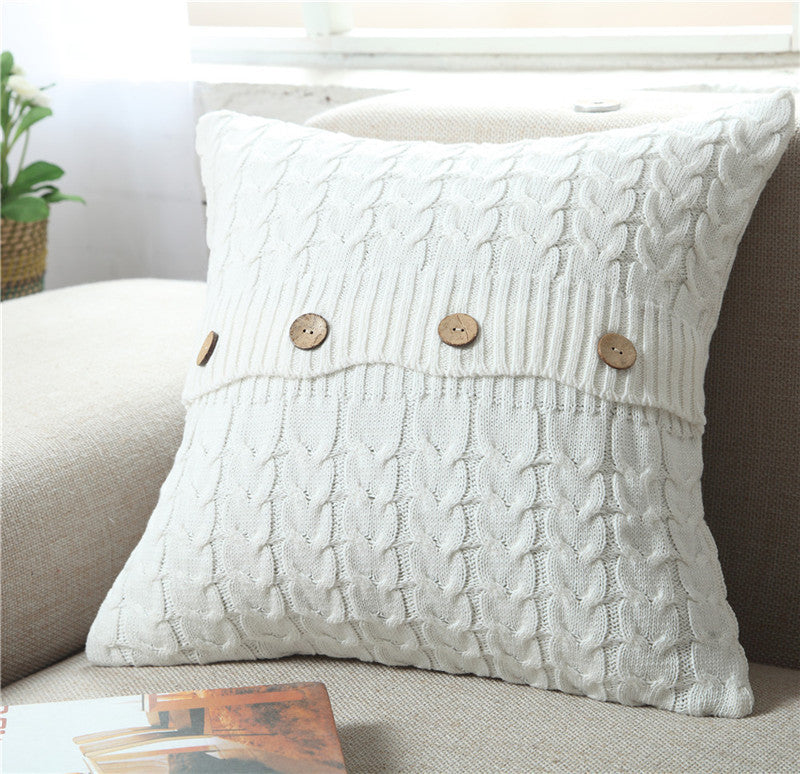 Woven Nordic minimalist pillowcase on a modern sofa in a neutral living room


