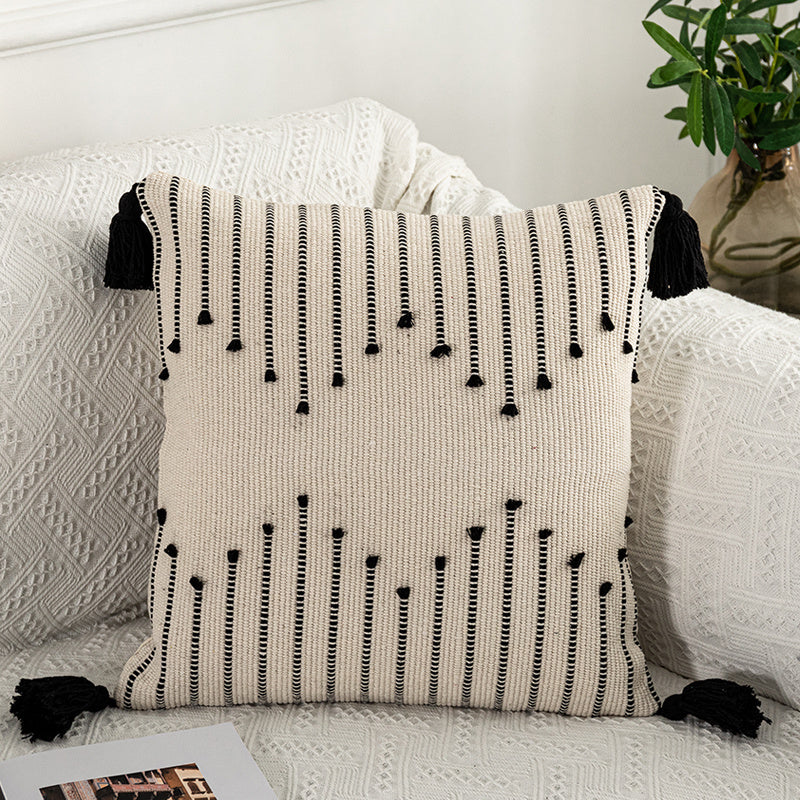 Bohemian Moroccan fringe pillowcase with ethnic patterns on a cozy sofa setting

