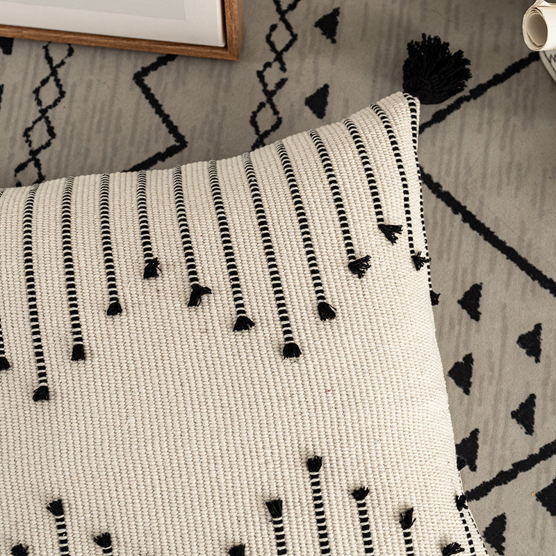 Bohemian Moroccan fringe pillowcase with ethnic patterns on a cozy sofa setting

