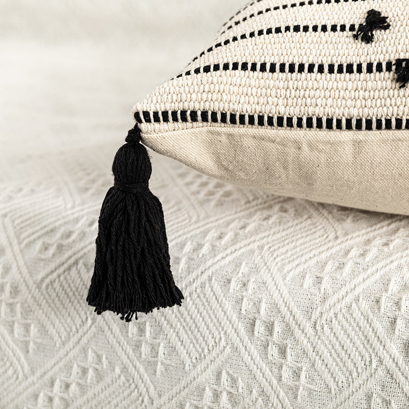 Bohemian Moroccan fringe pillowcase with ethnic patterns on a cozy sofa setting

