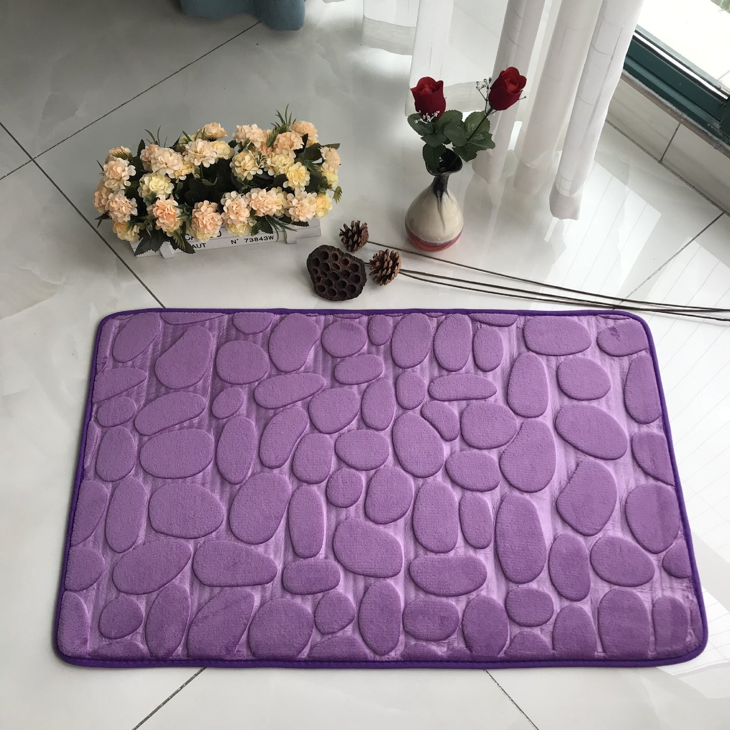Pebble embossed carpet with 3D texture placed in a cozy bedroom near a bed and nightstand

