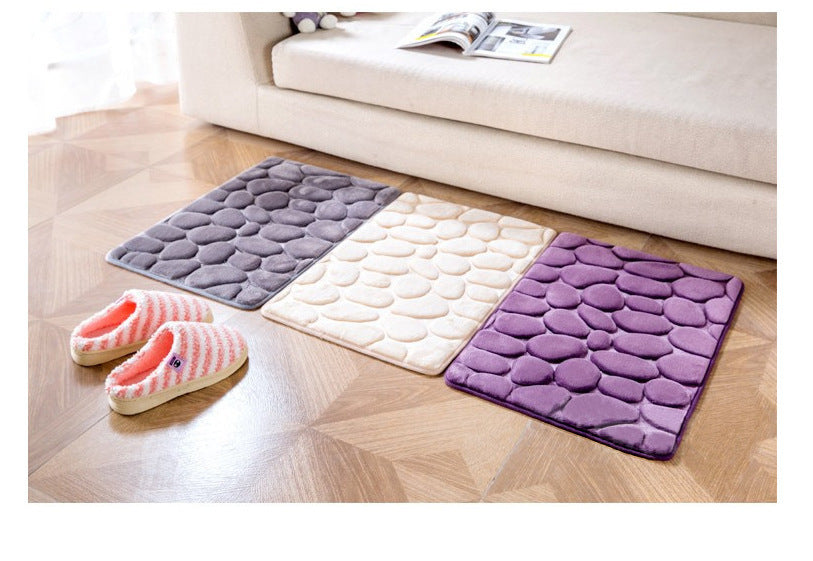 Pebble embossed carpet with 3D texture placed in a cozy bedroom near a bed and nightstand

