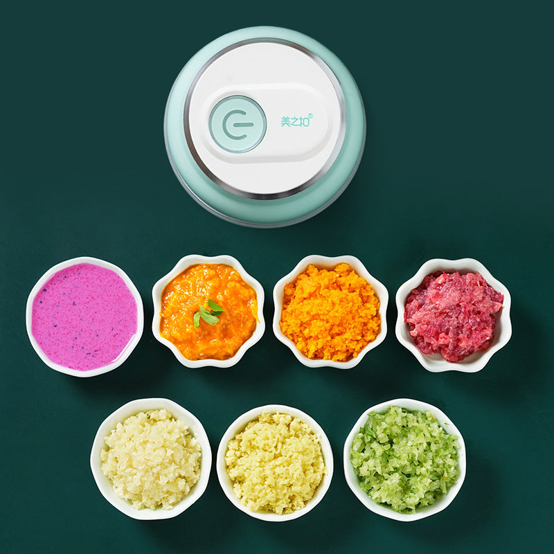 Portable electric mini garlic chopper and food grinder for quick cooking.