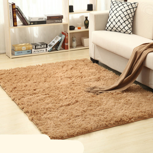 Soft carpet placed under a coffee table and beside a sofa in a cozy living room with neutral tones

