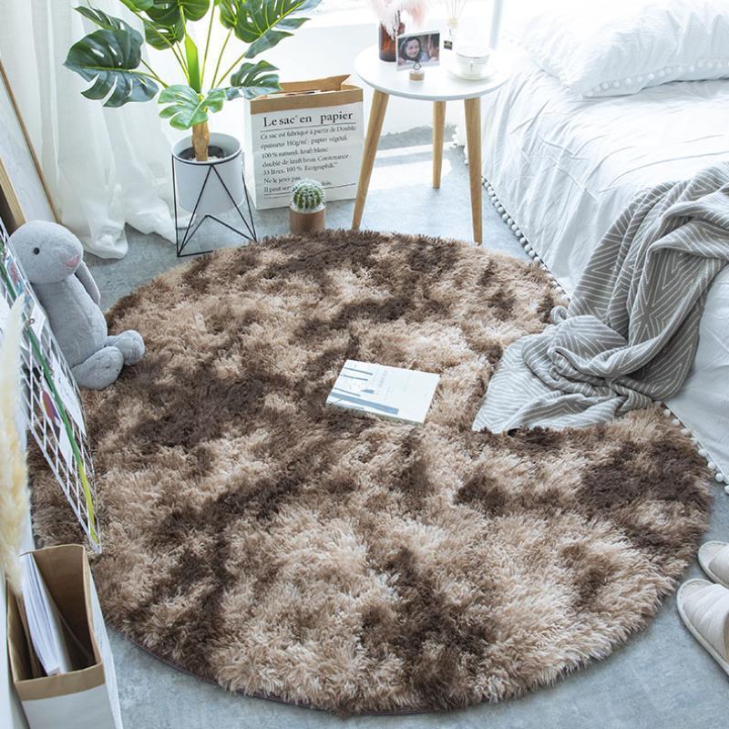 Nordic round silk wool carpet placed in a minimalist living room with natural light and cozy furniture

