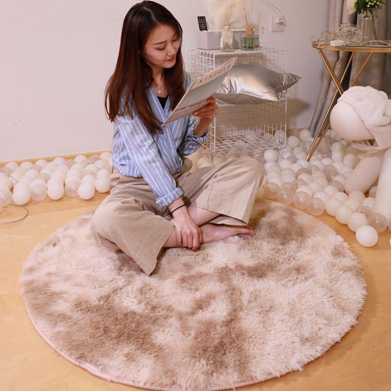 Nordic round silk wool carpet placed in a minimalist living room with natural light and cozy furniture

