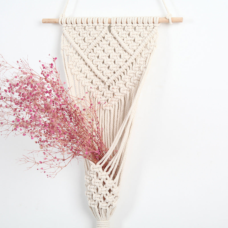 Woven net flower basket wall decoration for home and shop displays.