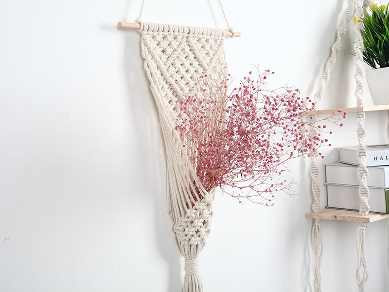Woven net flower basket wall decoration for home and shop displays.