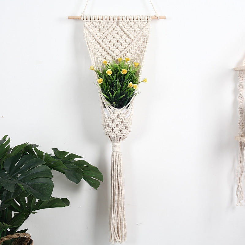 Woven net flower basket wall decoration for home and shop displays.