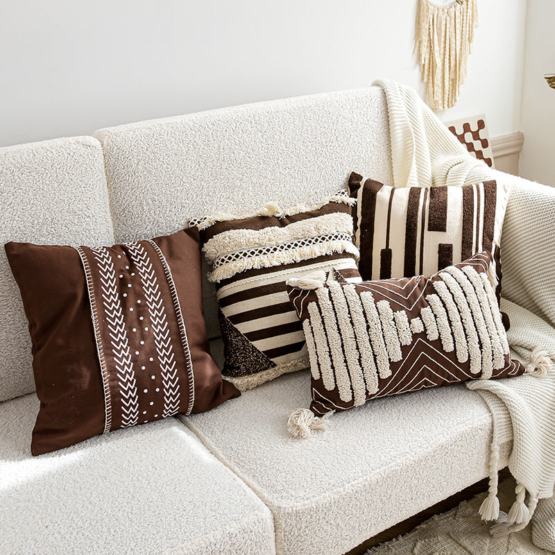 Nordic-style decorative cushion on a minimalist sofa with neutral tones


