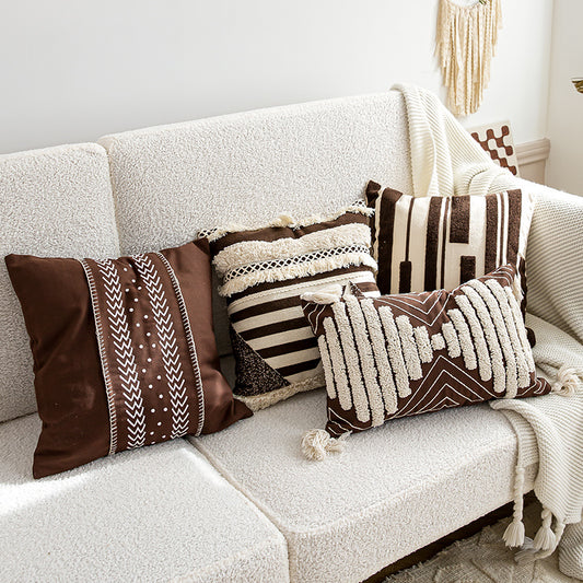 Nordic-style decorative cushion on a minimalist sofa with neutral tones

