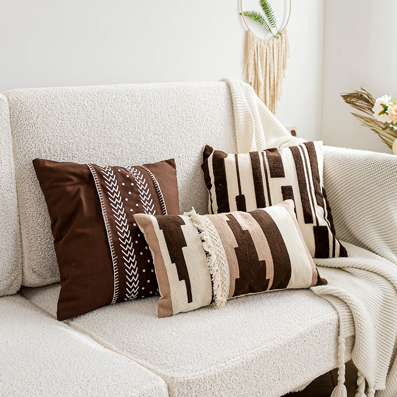 Nordic-style decorative cushion on a minimalist sofa with neutral tones

