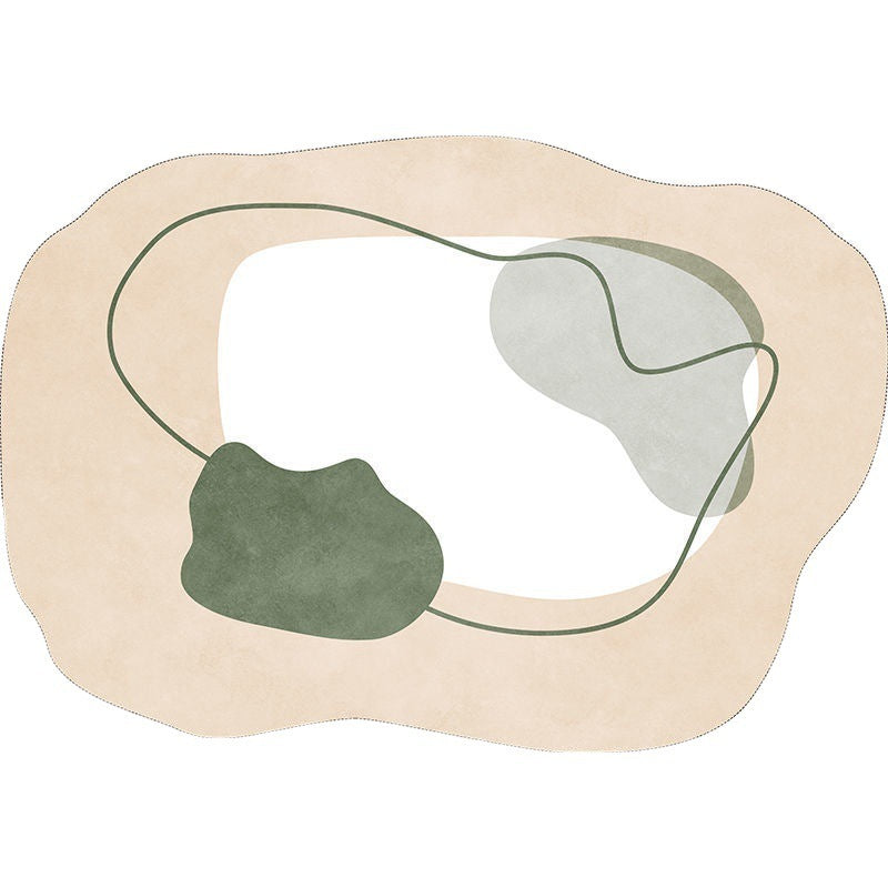 Irregular shaped carpet placed under a coffee table in a modern living room with artistic décor


